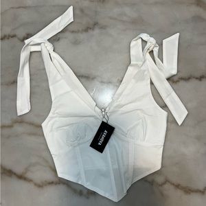 White crop top with ties on the shoulders